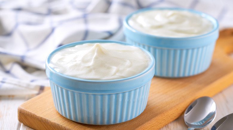 Greek yogurt being poured into dish