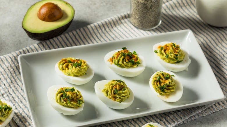 Avocado deviled eggs on platter