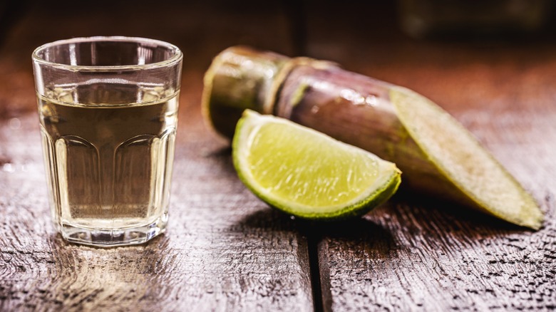 cachaça rum in shot glass with lime