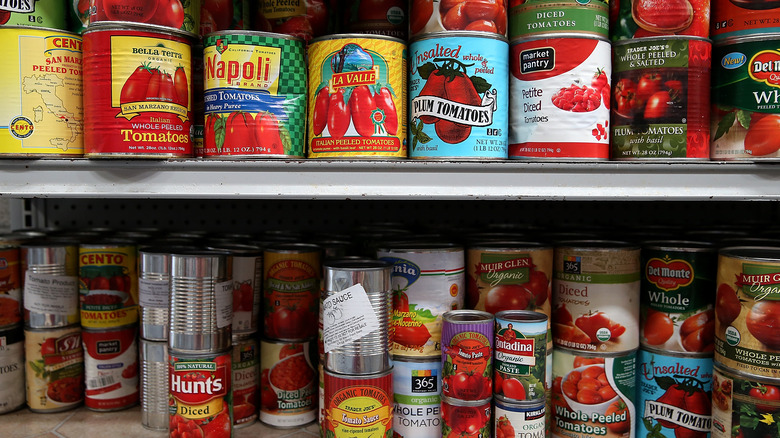 canned tomatoes on a store shelf