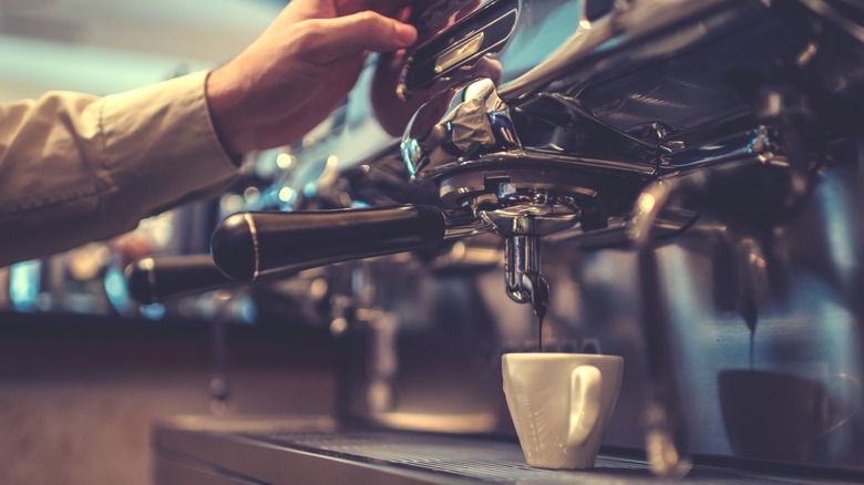 A barista pulling an espresso shot