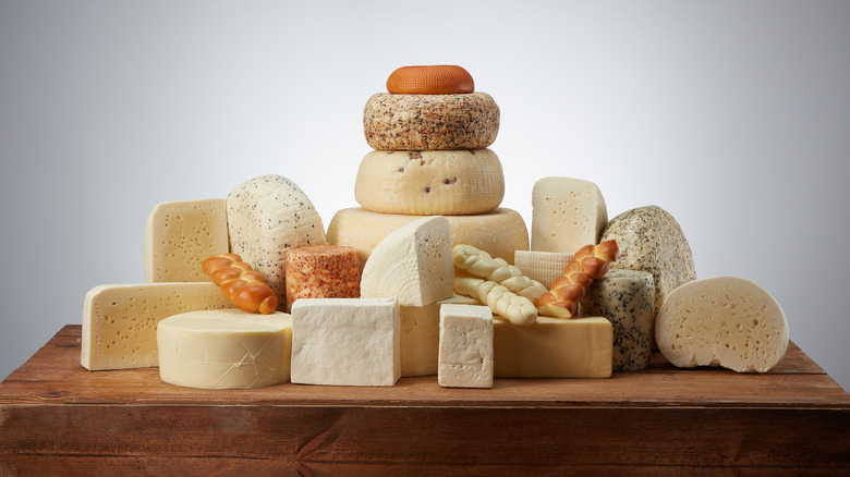 Multiple types of cheese on table
