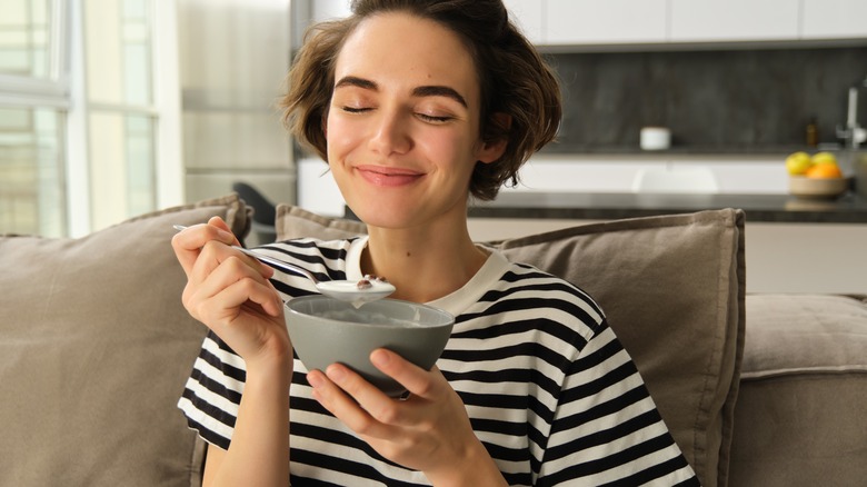 woman eating cereal