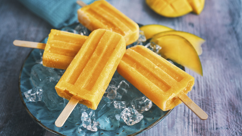 Mango popsicles on ice