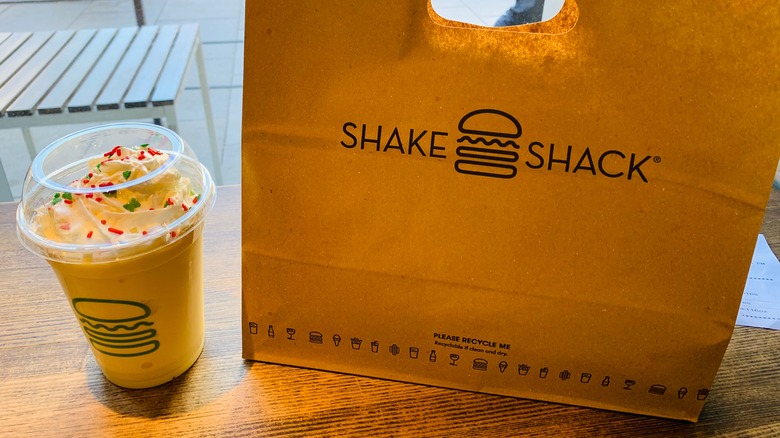 shake shack bag next to vanilla shake