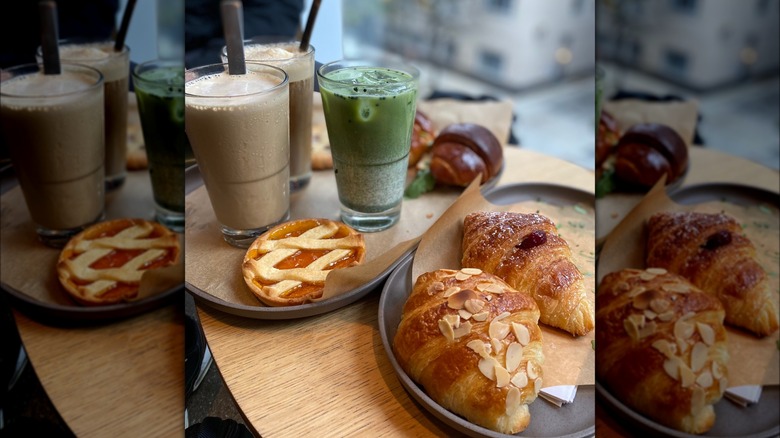 Starbucks drinks and croissants on trays