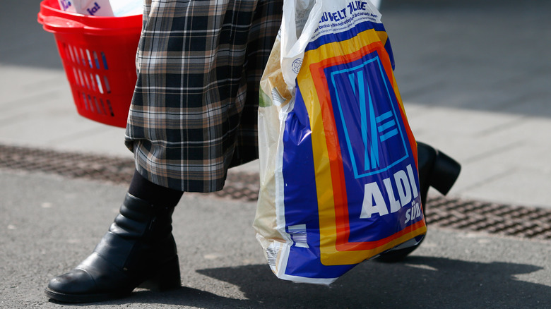 Aldi shopper carrying grocery bag