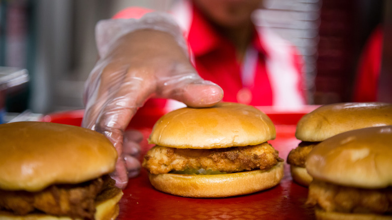 Wendy's employee reaching for chicken sandwich