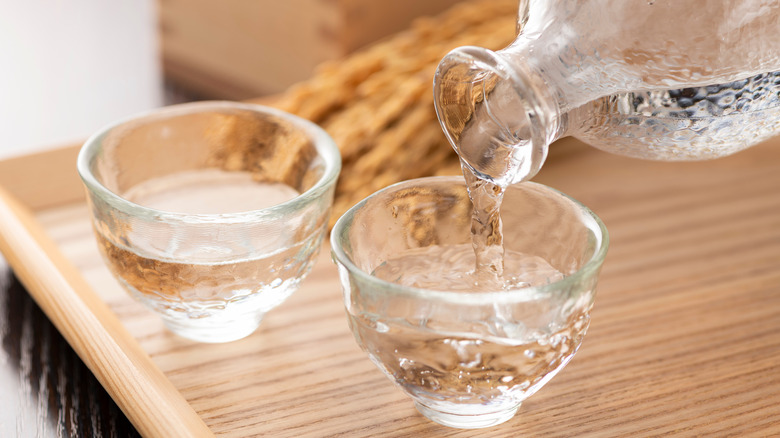 Sake being poured into glasses