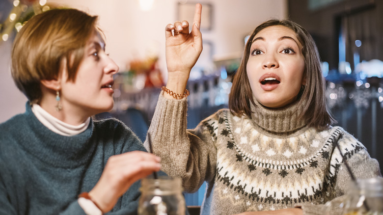 customer rudely signaling server with her finger