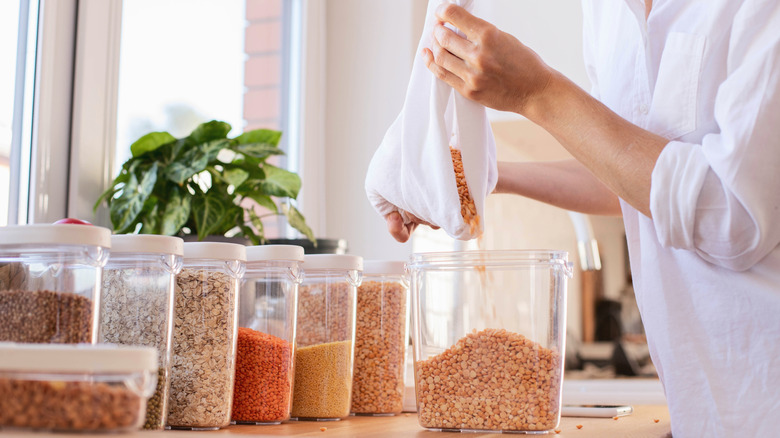 pouring dry goods into container