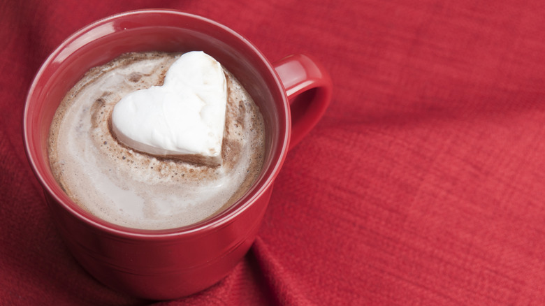 Heart-shaped marshmallow in a mug of cocoa