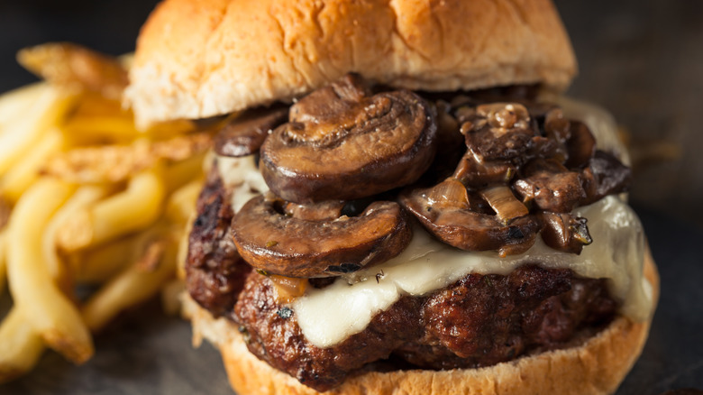 Burger with mushrooms on top