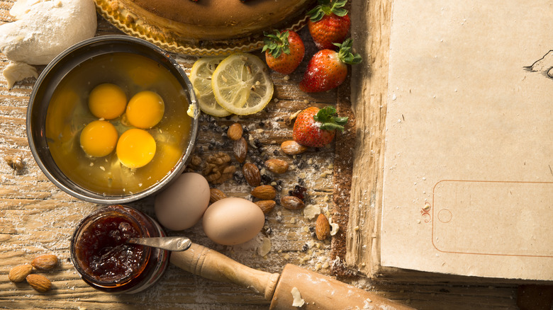 Cracked eggs with eggshell pieces 