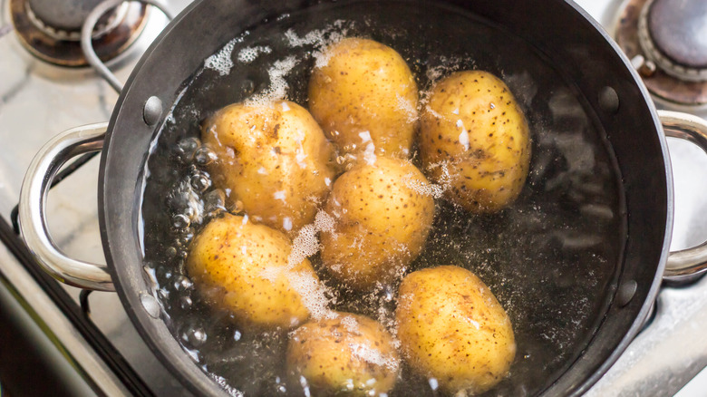 Boiling potatoes in pot