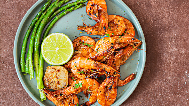 Cooked shrimp on blue plate