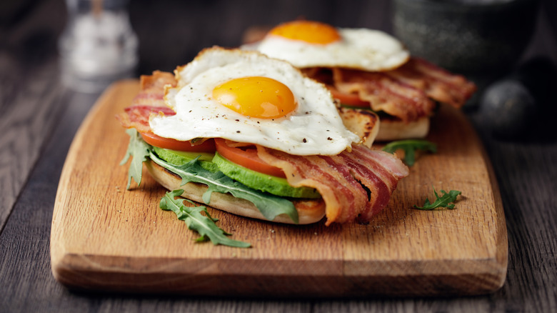 Fried egg over bacon avocado toast