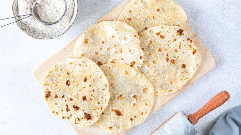 Flour tortillas on wooden board