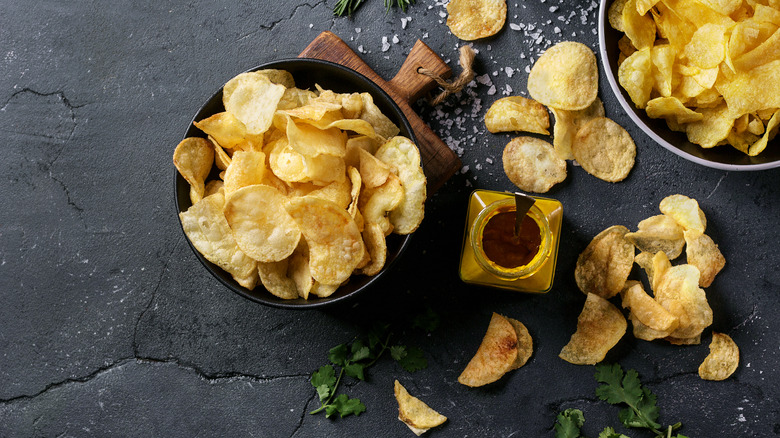 Potato chips on dark background