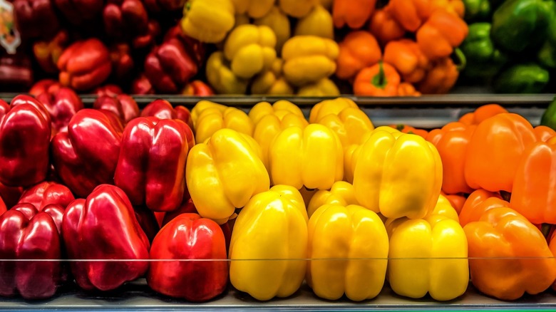 various colors of bell peppers in the produce section