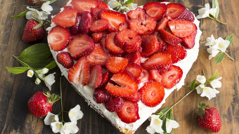 Heart-shaped cheesecake with strawberries