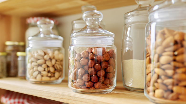 pantry shelf with jars of nuts