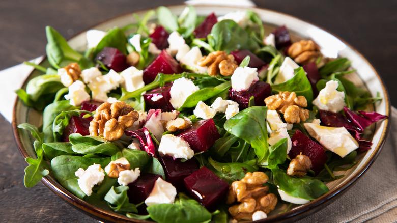 Walnuts in a spinach salad