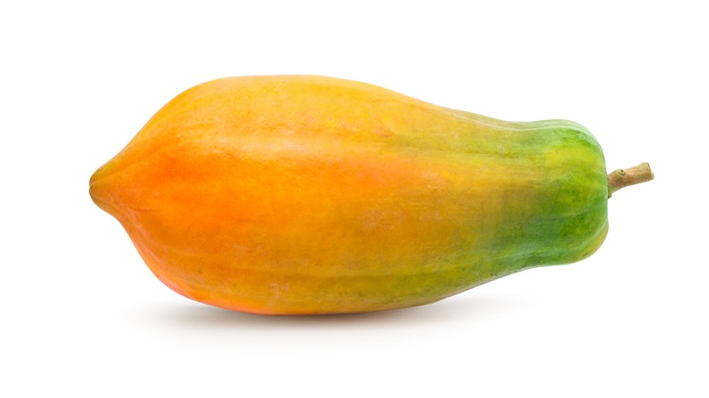 A ripening green-yellow papaya