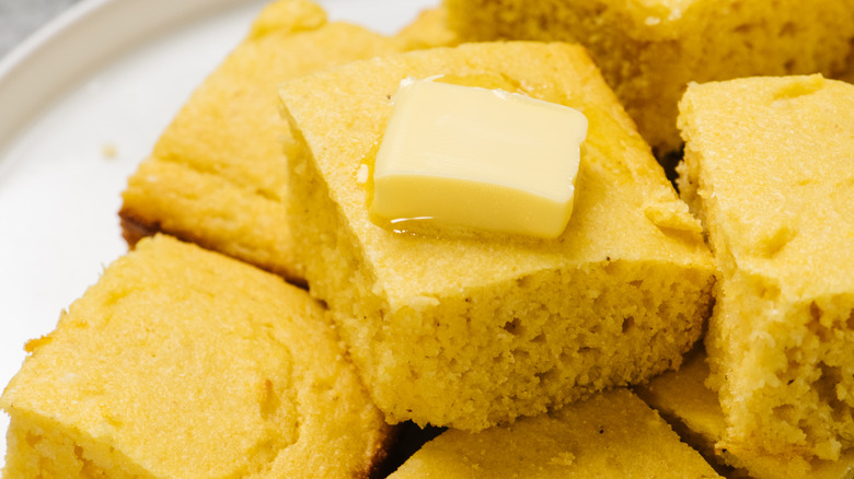 Cornbread squares with pat of butter