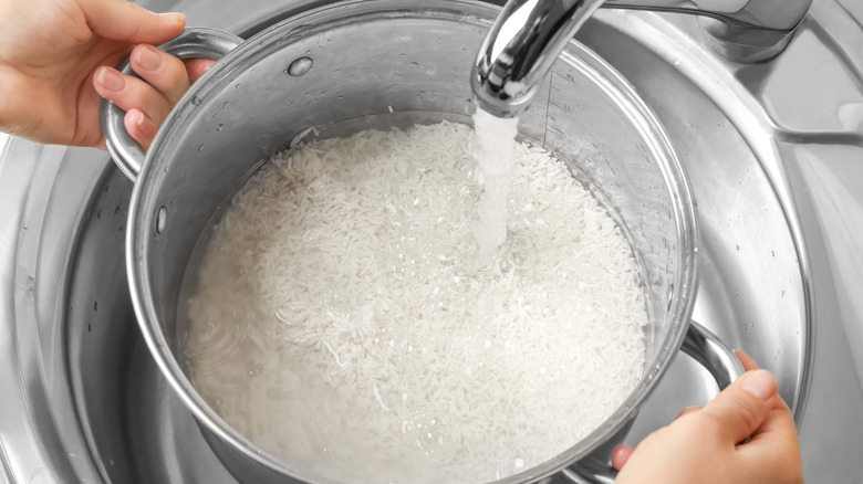 Close up of rice being rinsed