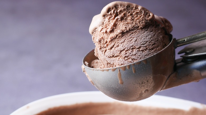 Chocolate ice cream in a scooper