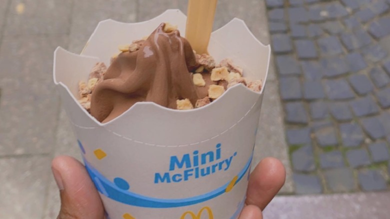 Closeup of hand holding a mini McFlurry