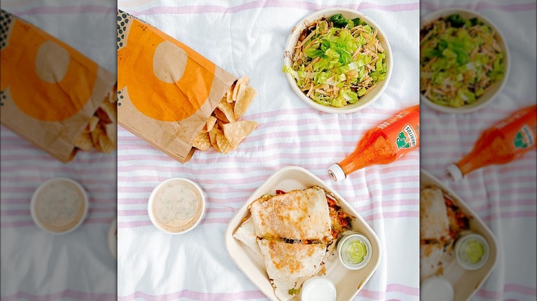 qdoba quesadilla and queso on a blanket