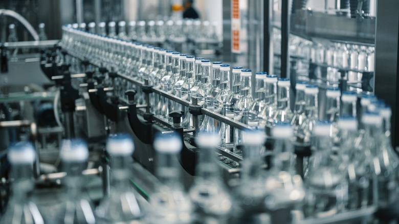 vodka bottles in an assembly line