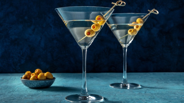 Two martini cocktails with olives