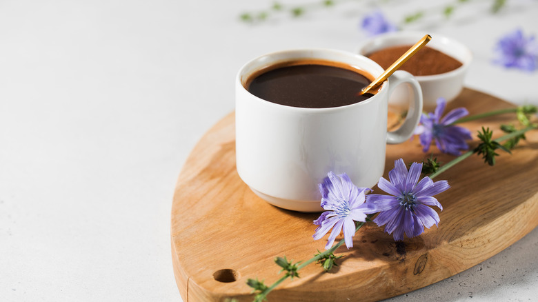 coffee cup with spoon and flowers 