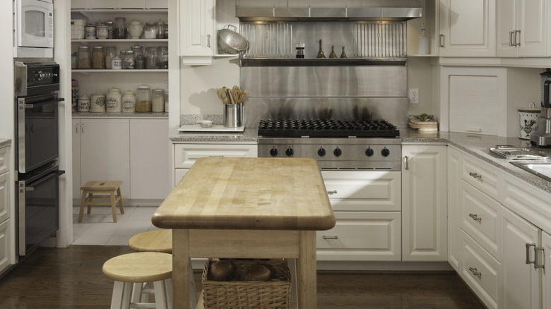 wooden kitchen island with chairs