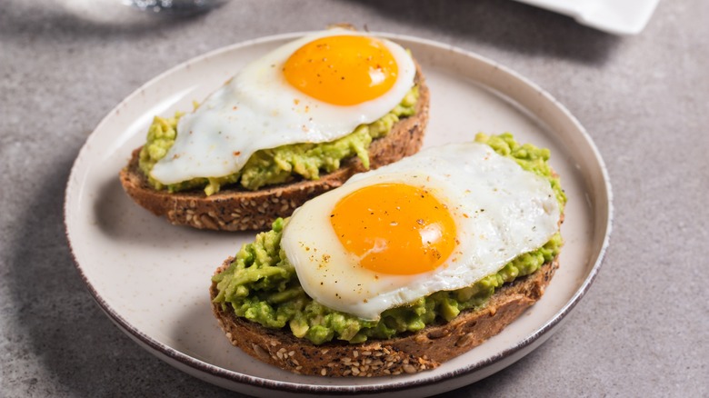 fried eggs on avocado toast