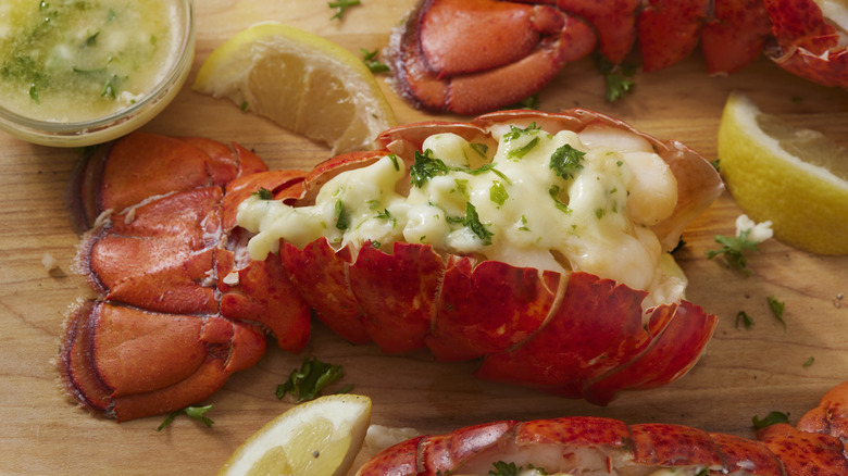 A lobster tail served with lemon.