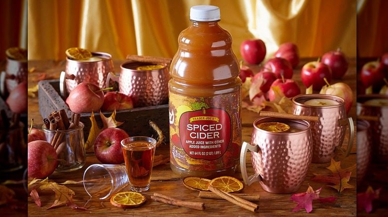 Trader Joe's spiced cider displayed on autumn table scape.