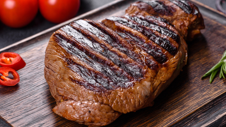 Cooked steak on cutting board