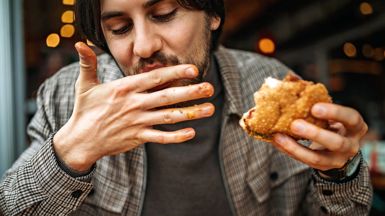 man eating a burger