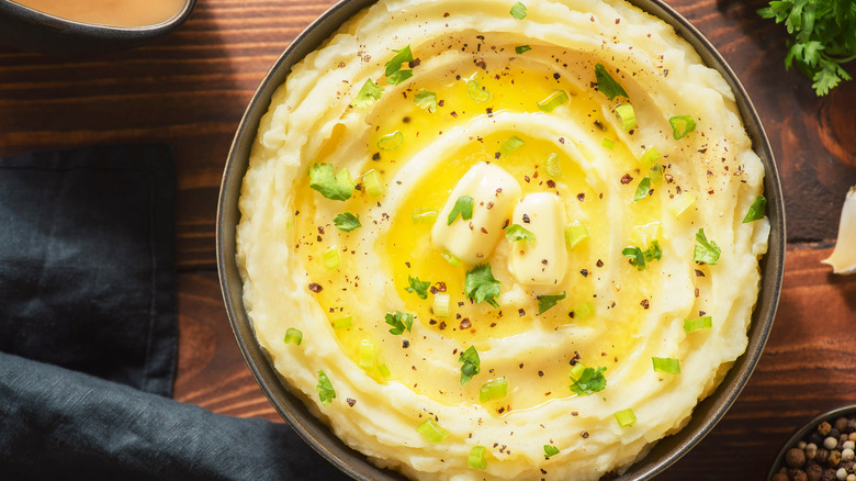 Bowl of mashed potatoes with butter