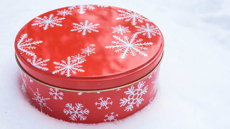 Holiday tin can in snow