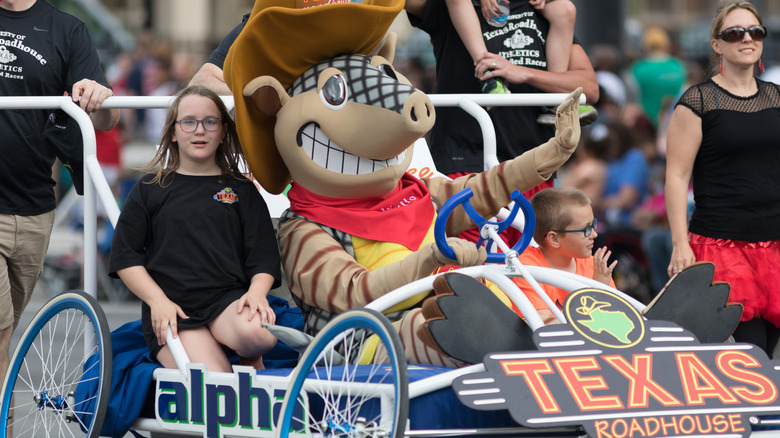 Texas roadhouse mascot in parade