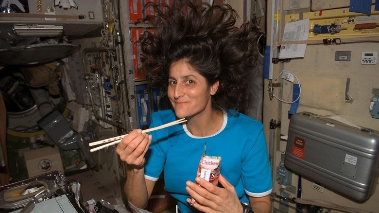 Astronaut Sunita Williams eating with chopsticks in space