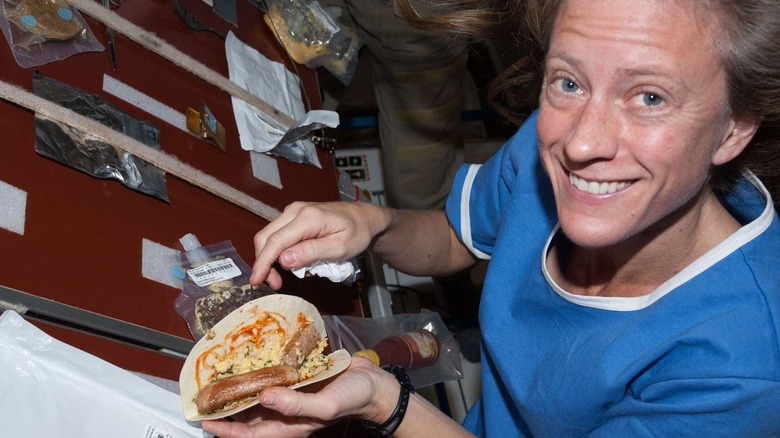 Astronaut Karen Nyberg making a breakfast taco in space