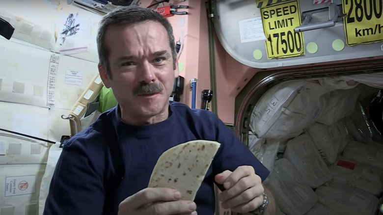 Astronaut Chris Hadfield with a tortilla