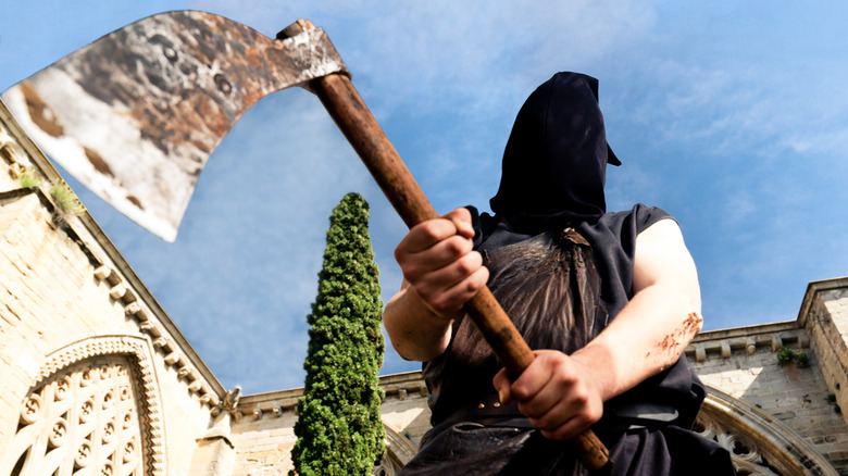 Hooded executioner wielding axe