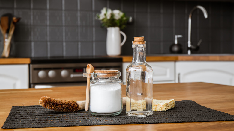 Vinegar and baking soda on a kitchen table